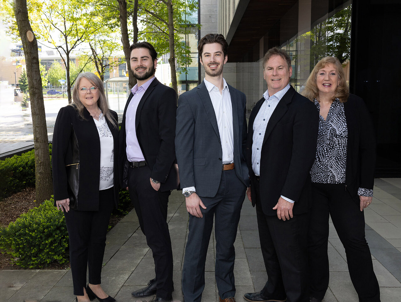 Team Photo of Frost Wealth Mangement with a Nature background blurred 